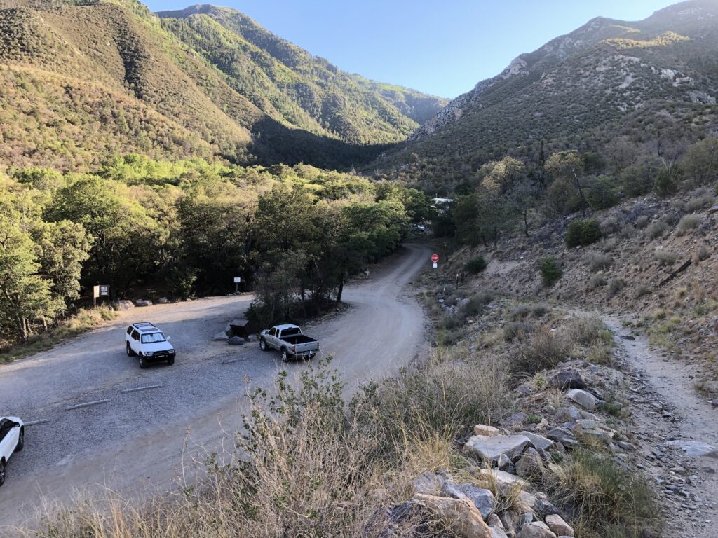 Parked our trucks and starting up the long trail to the Nellie James mine.