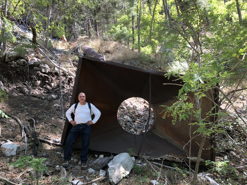 Here I am standing next to the large ore bin at the bottom of the mine dump.